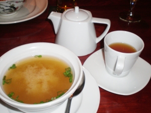traditional miso soup with tofu and green onion; hot fragrant tea